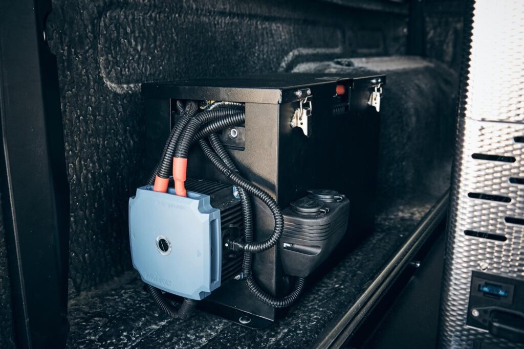 Auxiliary battery management system installed in the vehicle's canopy compartment
